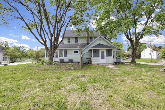 3610-3612 Grove City Rd, Grove City, OH 43123 - rear view of house featuring a lawn, cooling unit, a sunroom, and roof with shingles