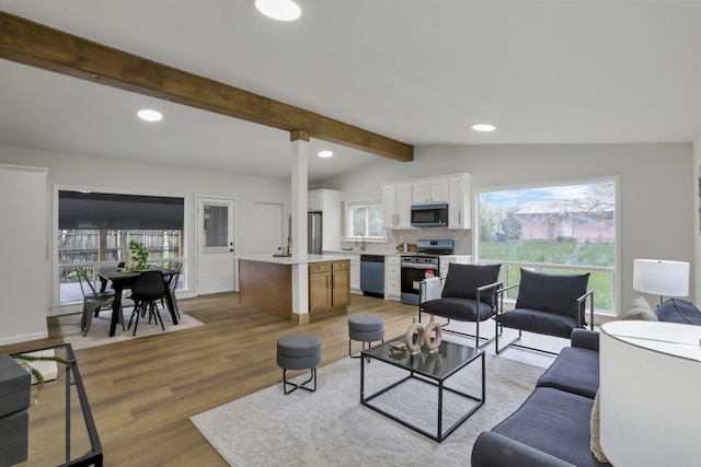 4502 Aragon Ave, Columbus, OH 43227 - living room featuring lofted ceiling with beams, light wood-type flooring, and recessed lighting