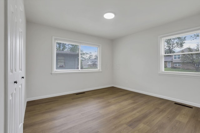 4502 Aragon Ave, Columbus, OH 43227 - unfurnished room with baseboards, visible vents, and wood finished floors