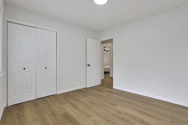 4502 Aragon Ave, Columbus, OH 43227 - unfurnished bedroom featuring baseboards, a closet, and wood finished floors