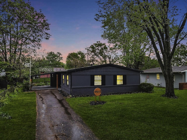 4502 Aragon Ave, Columbus, OH 43227 - ranch-style home with a lawn and aphalt driveway
