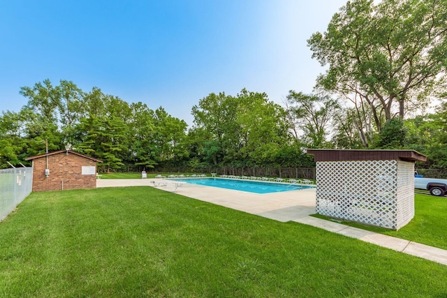 view of swimming pool featuring view of scattered trees