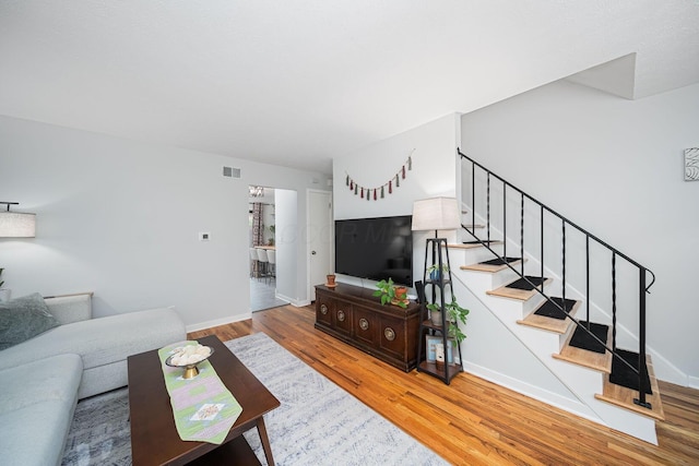 1779 Willoway Cir N, Columbus, OH 43220 - living area featuring wood finished floors, stairs, and baseboards