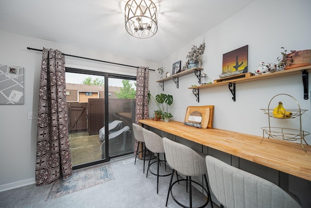 1779 Willoway Cir N, Columbus, OH 43220 - dining area featuring baseboards and a chandelier
