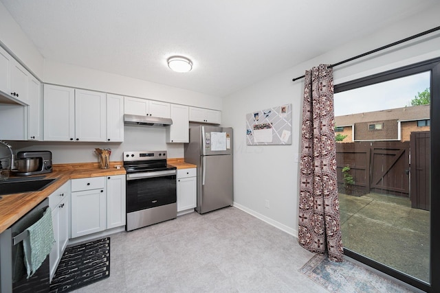 1779 Willoway Cir N, Columbus, OH 43220 - kitchen featuring wooden counters, stainless steel appliances, under cabinet range hood, a sink, and light floors