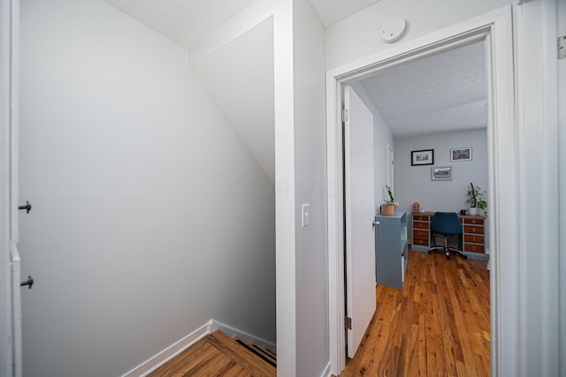 1779 Willoway Cir N, Columbus, OH 43220 - hall with a desk, light wood finished floors, and a textured ceiling