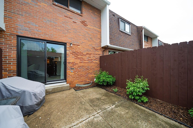 1779 Willoway Cir N, Columbus, OH 43220 - back of property featuring fence, brick siding, and a patio area
