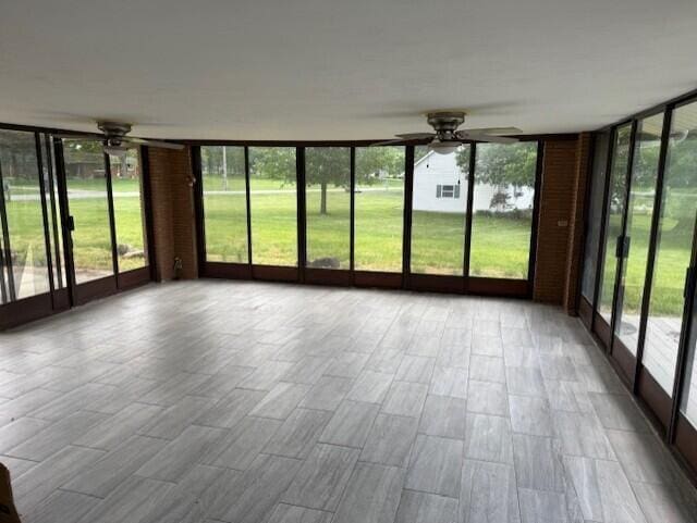 8165 Busey Rd, Pickerington, OH 43147 - unfurnished sunroom with a wall of windows