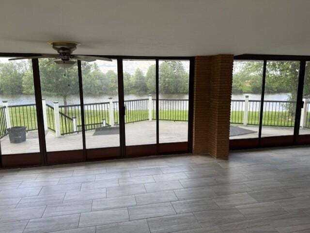 8165 Busey Rd, Pickerington, OH 43147 - doorway featuring a water view, ceiling fan, and floor to ceiling windows