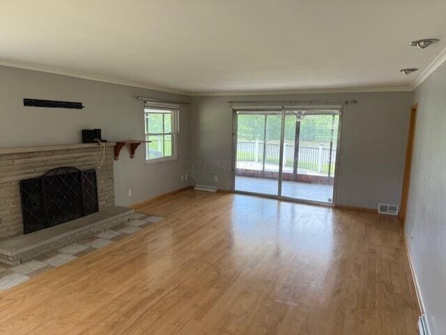 8165 Busey Rd, Pickerington, OH 43147 - unfurnished living room featuring crown molding, wood finished floors, baseboards, and a fireplace