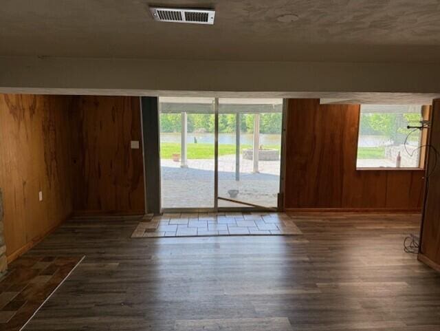 8165 Busey Rd, Pickerington, OH 43147 - unfurnished room with wood finished floors, plenty of natural light, and wooden walls