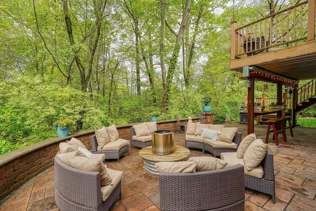 view of patio featuring stairs and an outdoor living space