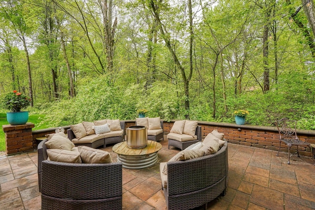 view of patio featuring an outdoor hangout area and a wooded view