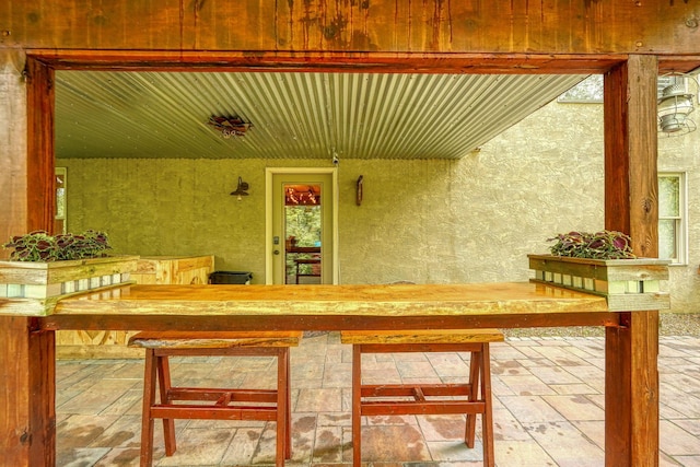 exterior space featuring stucco siding and a porch
