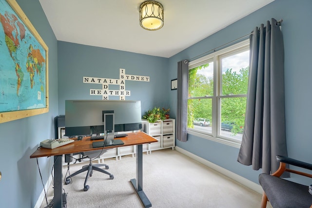 office with baseboards and carpet floors