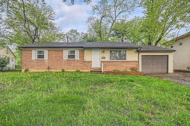 single story home with brick siding, an attached garage, entry steps, and driveway
