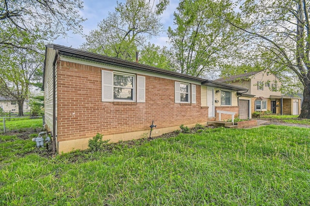split level home with brick siding and a garage