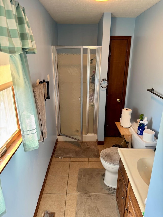 6 Oakwood Dr, Chillicothe, OH 45601 - bathroom with tile patterned flooring, a stall shower, vanity, and baseboards