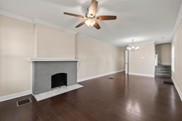 unfurnished living room featuring a fireplace, stairway, ornamental molding, hardwood / wood-style flooring, and a chandelier