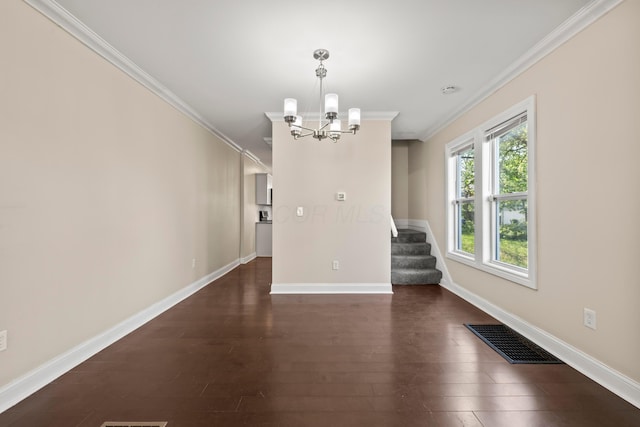 unfurnished dining area featuring a chandelier, crown molding, baseboards, and dark wood-style flooring