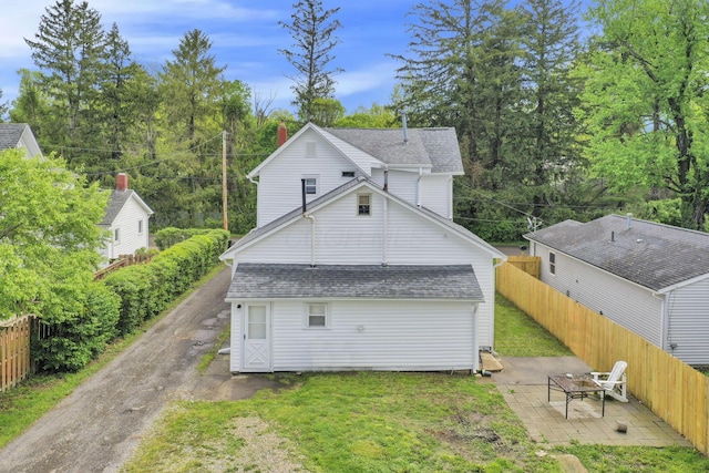 233-235 N 13th St, Newark, OH 43055 - view of home's exterior with a patio area and roof with shingles
