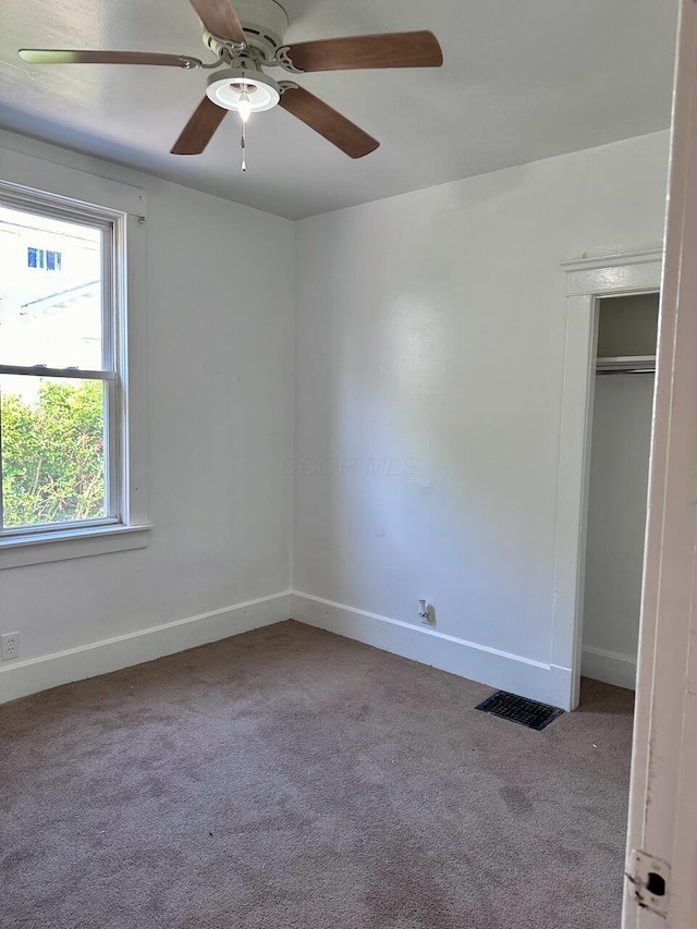 233-235 N 13th St, Newark, OH 43055 - unfurnished bedroom featuring carpet flooring, baseboards, and a ceiling fan