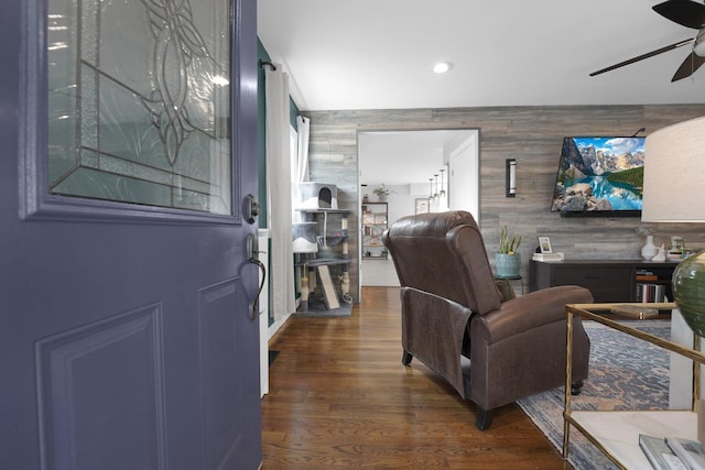 591 French Dr, Columbus, OH 43228 - living area featuring a ceiling fan, an accent wall, dark wood-type flooring, and recessed lighting