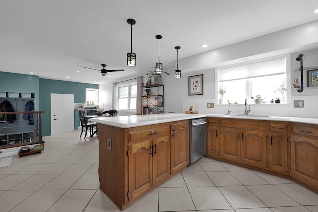 591 French Dr, Columbus, OH 43228 - kitchen with a sink, dishwasher, ceiling fan, light countertops, and brown cabinets