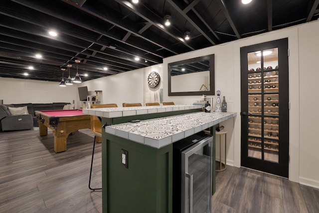 591 French Dr, Columbus, OH 43228 - kitchen with wine cooler, a kitchen breakfast bar, tile countertops, green cabinetry, and open floor plan
