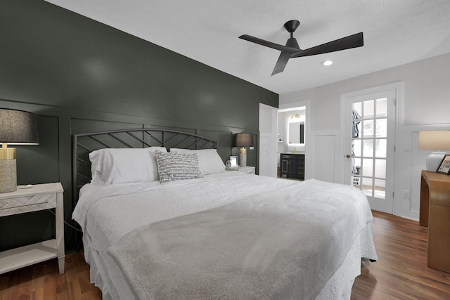 591 French Dr, Columbus, OH 43228 - bedroom featuring a decorative wall, wood finished floors, a ceiling fan, wainscoting, and ensuite bathroom