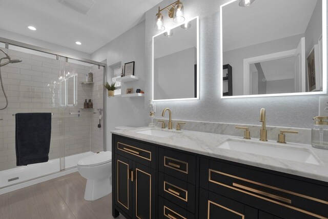 591 French Dr, Columbus, OH 43228 - bathroom featuring a shower stall, double vanity, toilet, and recessed lighting