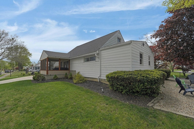 591 French Dr, Columbus, OH 43228 - view of home's exterior featuring a yard, a shingled roof, and a sunroom