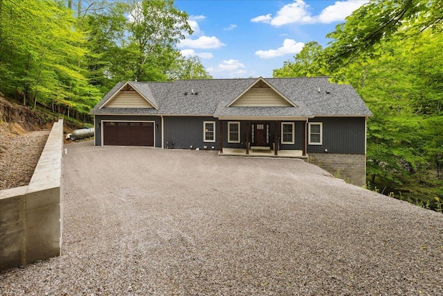 659 Natchez Ln, Sugar Grove, OH 43155 - single story home featuring a garage, covered porch, roof with shingles, and dirt driveway