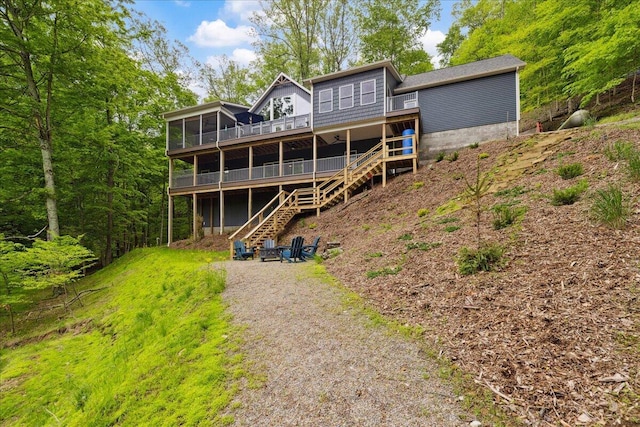 659 Natchez Ln, Sugar Grove, OH 43155 - back of house with a sunroom, stairs, and a deck