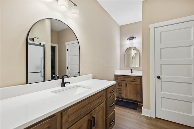 659 Natchez Ln, Sugar Grove, OH 43155 - bathroom featuring wood finished floors and two vanities