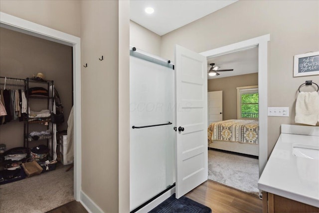 659 Natchez Ln, Sugar Grove, OH 43155 - ensuite bathroom featuring ceiling fan, wood finished floors, double vanity, and baseboards