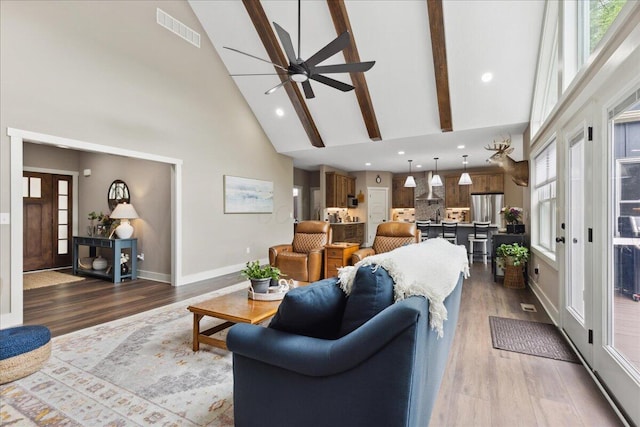 659 Natchez Ln, Sugar Grove, OH 43155 - living area featuring high vaulted ceiling, ceiling fan, baseboards, dark wood finished floors, and beam ceiling