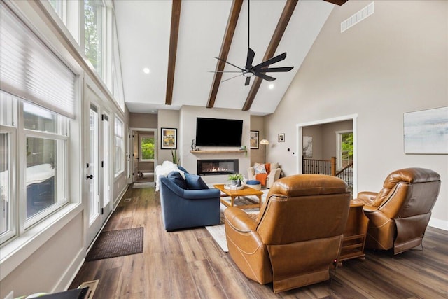 659 Natchez Ln, Sugar Grove, OH 43155 - living area with high vaulted ceiling, a glass covered fireplace, ceiling fan, wood finished floors, and baseboards