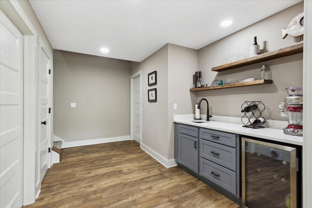 659 Natchez Ln, Sugar Grove, OH 43155 - indoor wet bar featuring beverage cooler, wood finished floors, baseboards, and recessed lighting