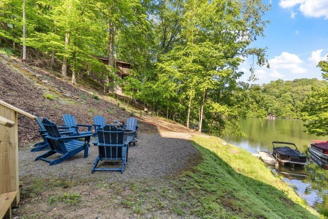 659 Natchez Ln, Sugar Grove, OH 43155 - view of yard featuring an outdoor fire pit, a water view, and a view of trees