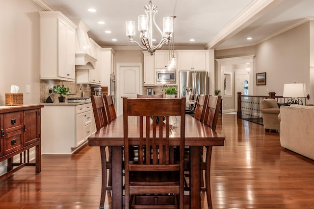 5464 Slater Rdg, Westerville, OH 43082 - dining space featuring a chandelier, ornamental molding, dark wood-style floors, and recessed lighting