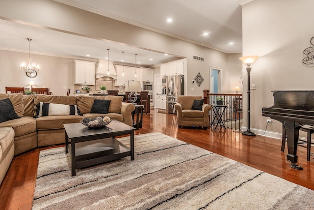 5464 Slater Rdg, Westerville, OH 43082 - living area featuring dark wood finished floors, a chandelier, ornamental molding, baseboards, and recessed lighting