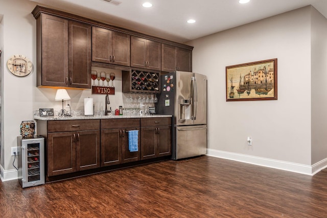 5464 Slater Rdg, Westerville, OH 43082 - indoor wet bar featuring stainless steel refrigerator with ice dispenser, baseboards, dark wood-style floors, beverage cooler, and recessed lighting