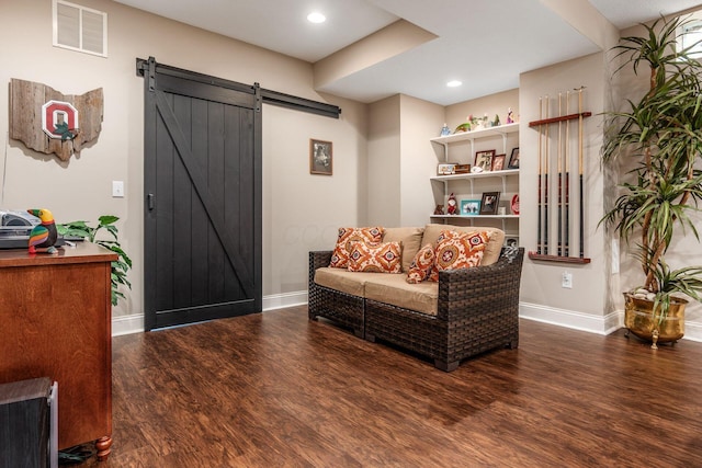 5464 Slater Rdg, Westerville, OH 43082 - sitting room featuring a barn door, wood finished floors, baseboards, and recessed lighting