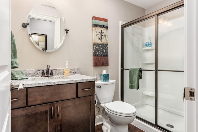 5464 Slater Rdg, Westerville, OH 43082 - full bathroom featuring a stall shower, toilet, vanity, and wood finished floors