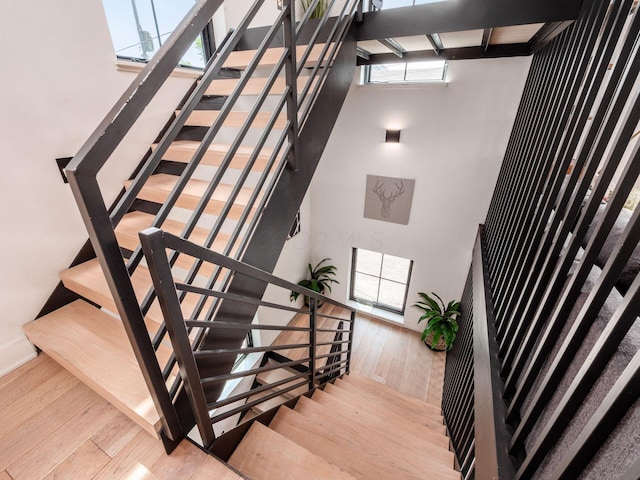 460 S Lane Unit 460, Columbus, OH 43206 - stairway featuring hardwood / wood-style flooring, a high ceiling, and baseboards