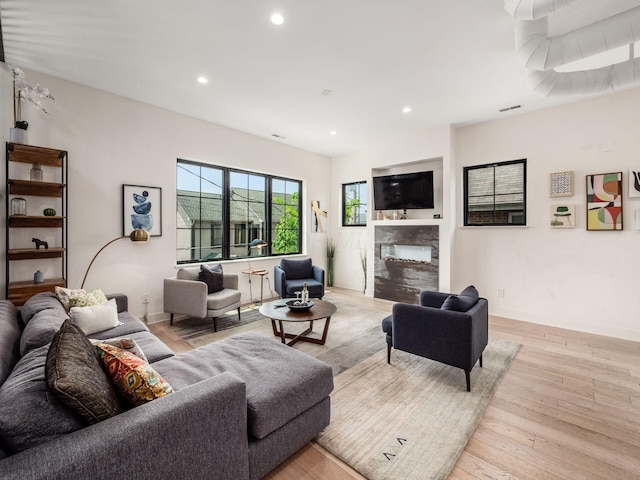 460 S Lane Unit 460, Columbus, OH 43206 - living area featuring recessed lighting, a fireplace, light wood finished floors, and baseboards
