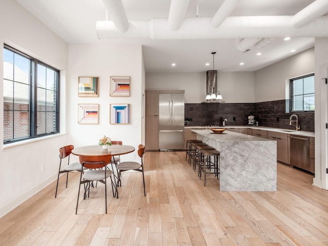 460 S Lane Unit 460, Columbus, OH 43206 - kitchen with appliances with stainless steel finishes, modern cabinets, a center island, plenty of natural light, and recessed lighting