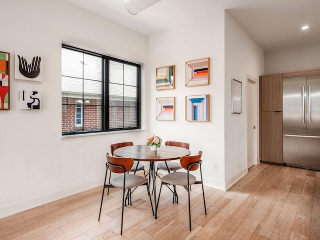 460 S Lane Unit 460, Columbus, OH 43206 - dining area featuring light wood finished floors, baseboards, and recessed lighting