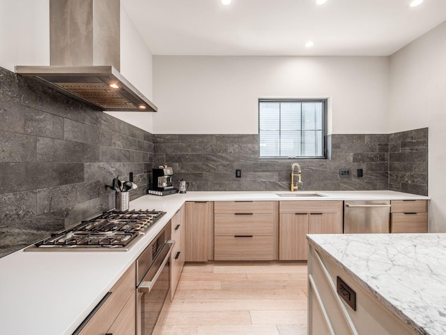 460 S Lane Unit 460, Columbus, OH 43206 - kitchen with wall chimney exhaust hood, light brown cabinets, a sink, appliances with stainless steel finishes, and light wood-style flooring